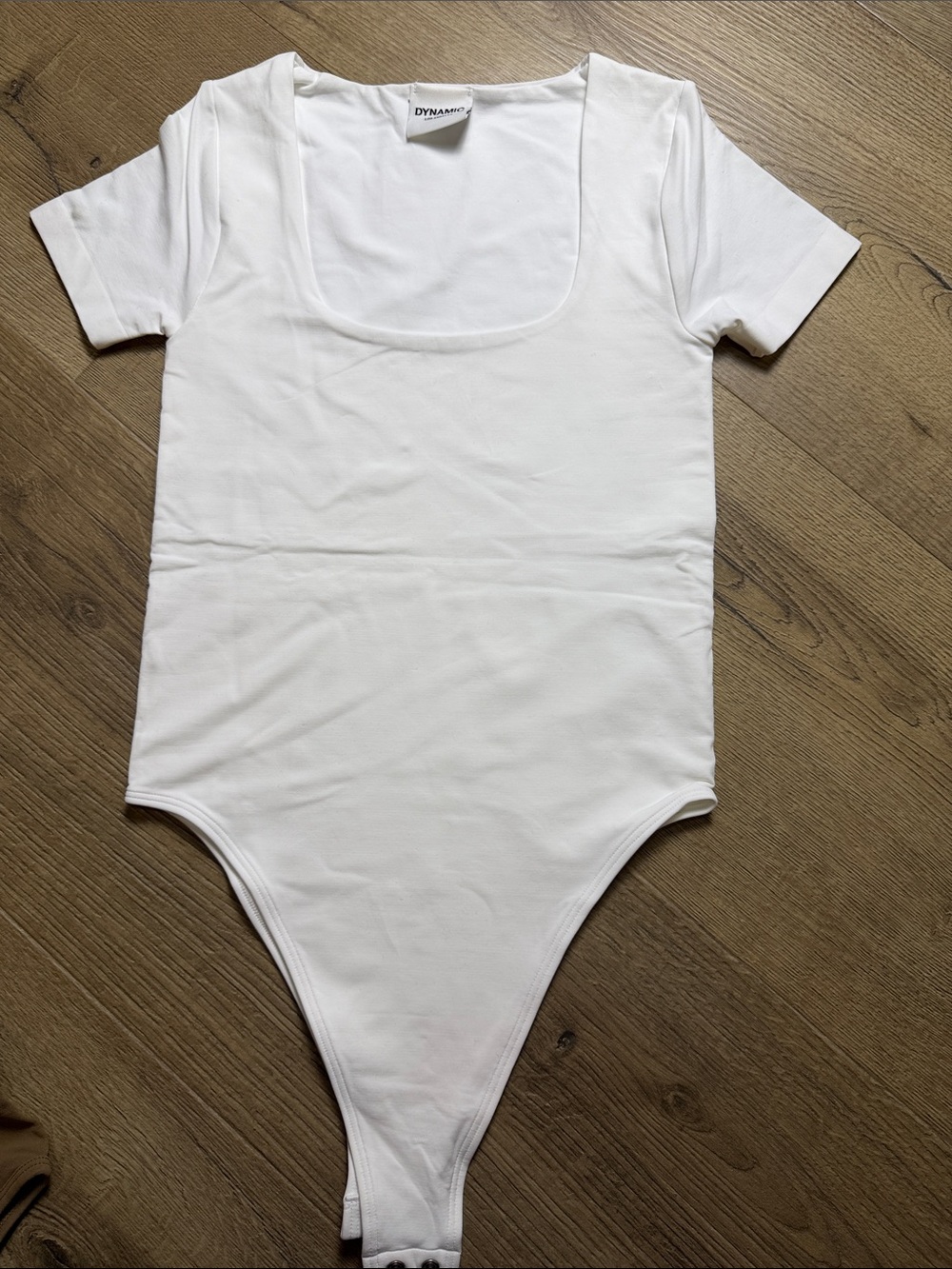 White Scoop Neck Short Sleeve Bodysuit, never worn. One size fits most
